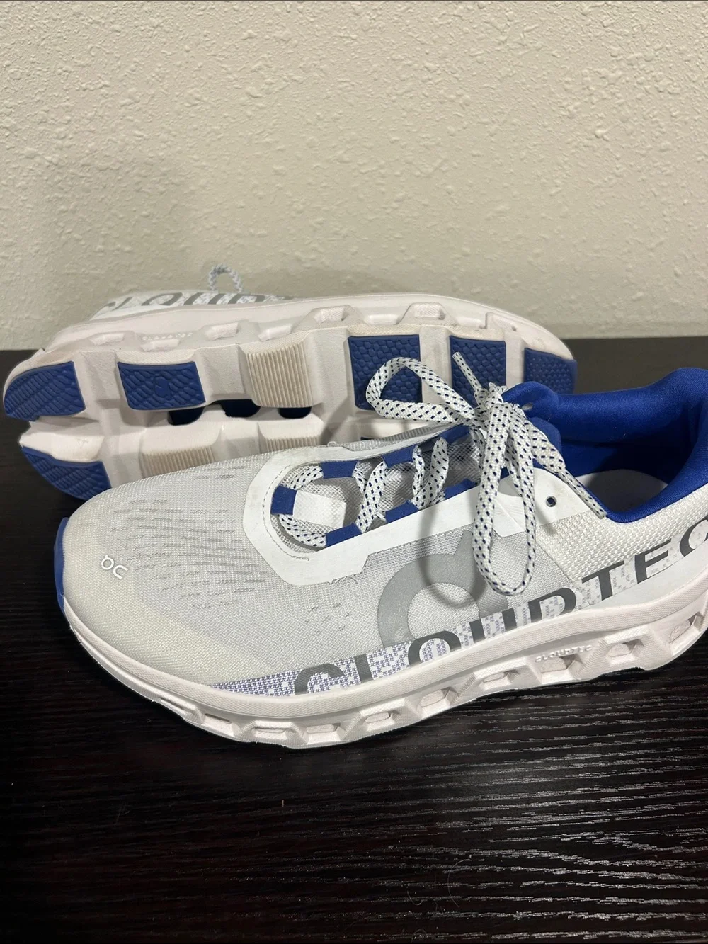On Running White and Blue Cloudmonster Sneakers